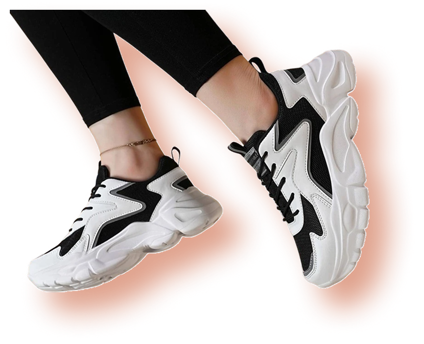 Legs wearing black and white chunky sneakers